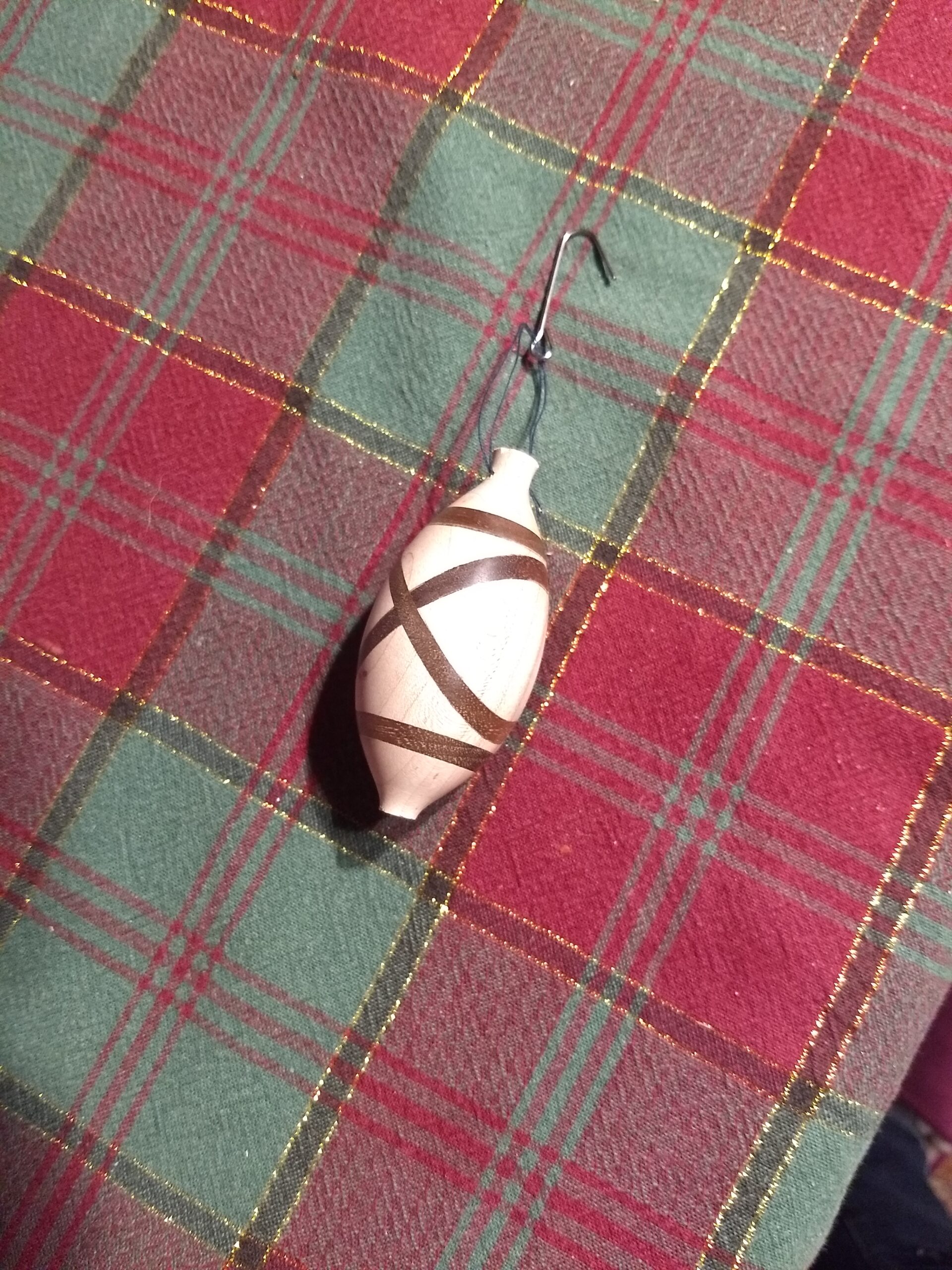 Tree ornament on Christmas tablecloth